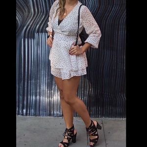 Long sleeve romper. Black and white. 31” long